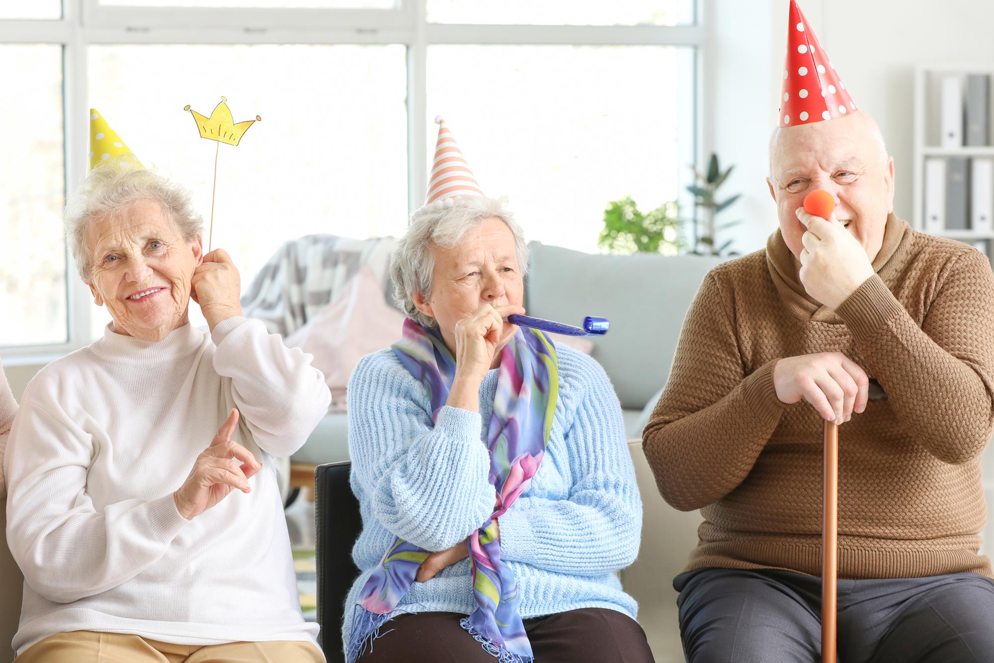 Seniors celebrating with party hats
