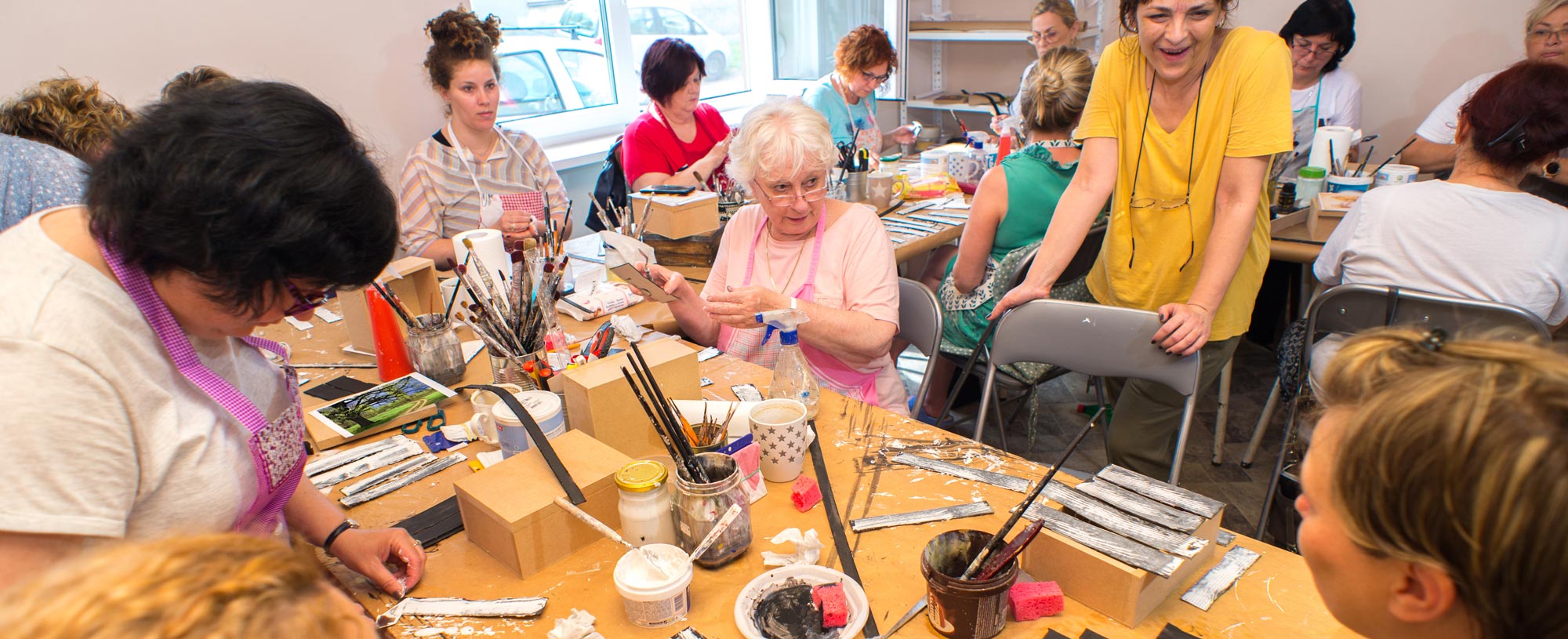 Members crafting together around a table