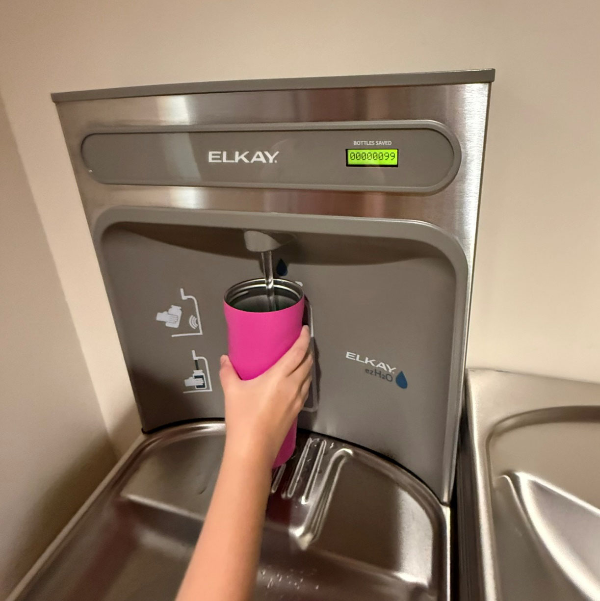 Filling a water bottle at the refilling station