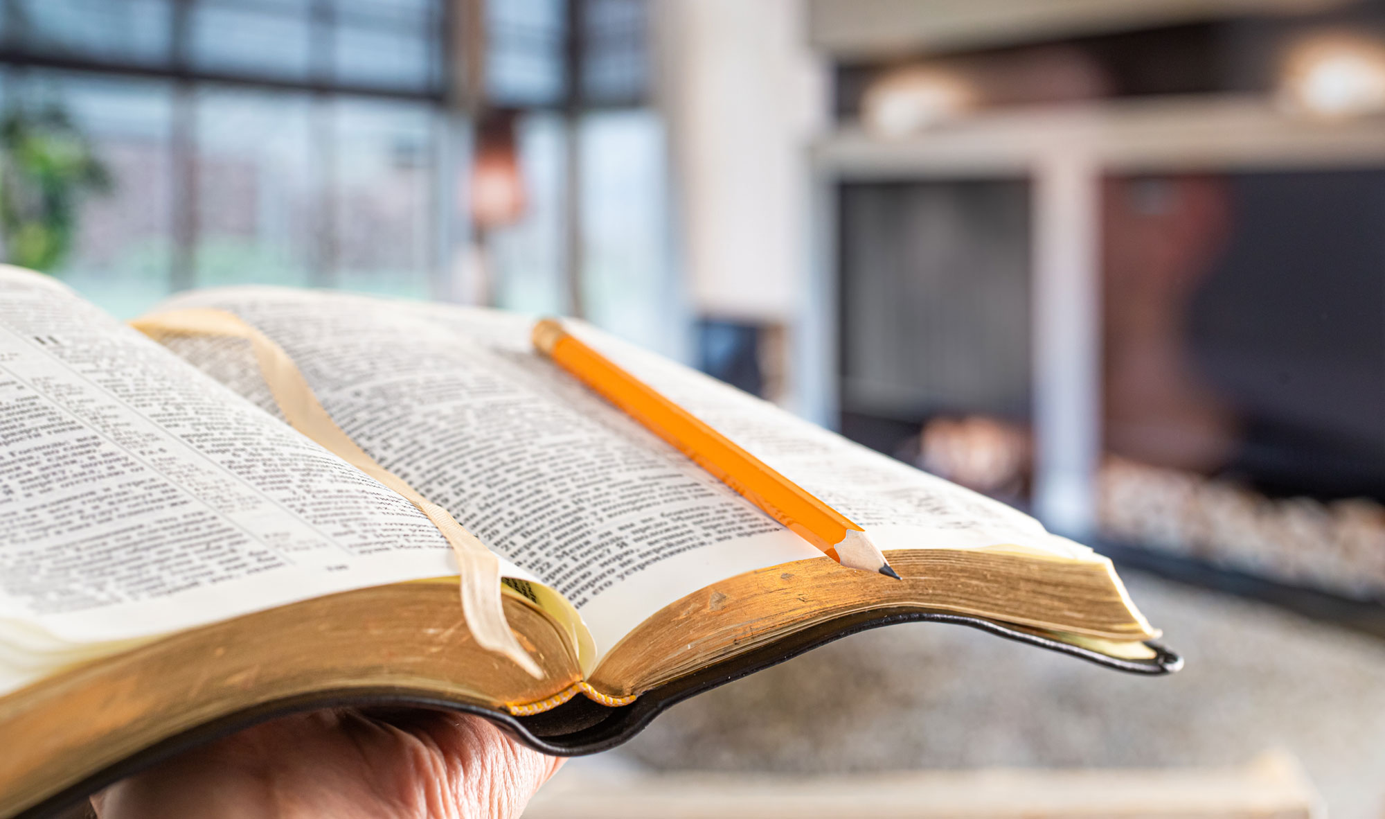 Open Bible with a pencil