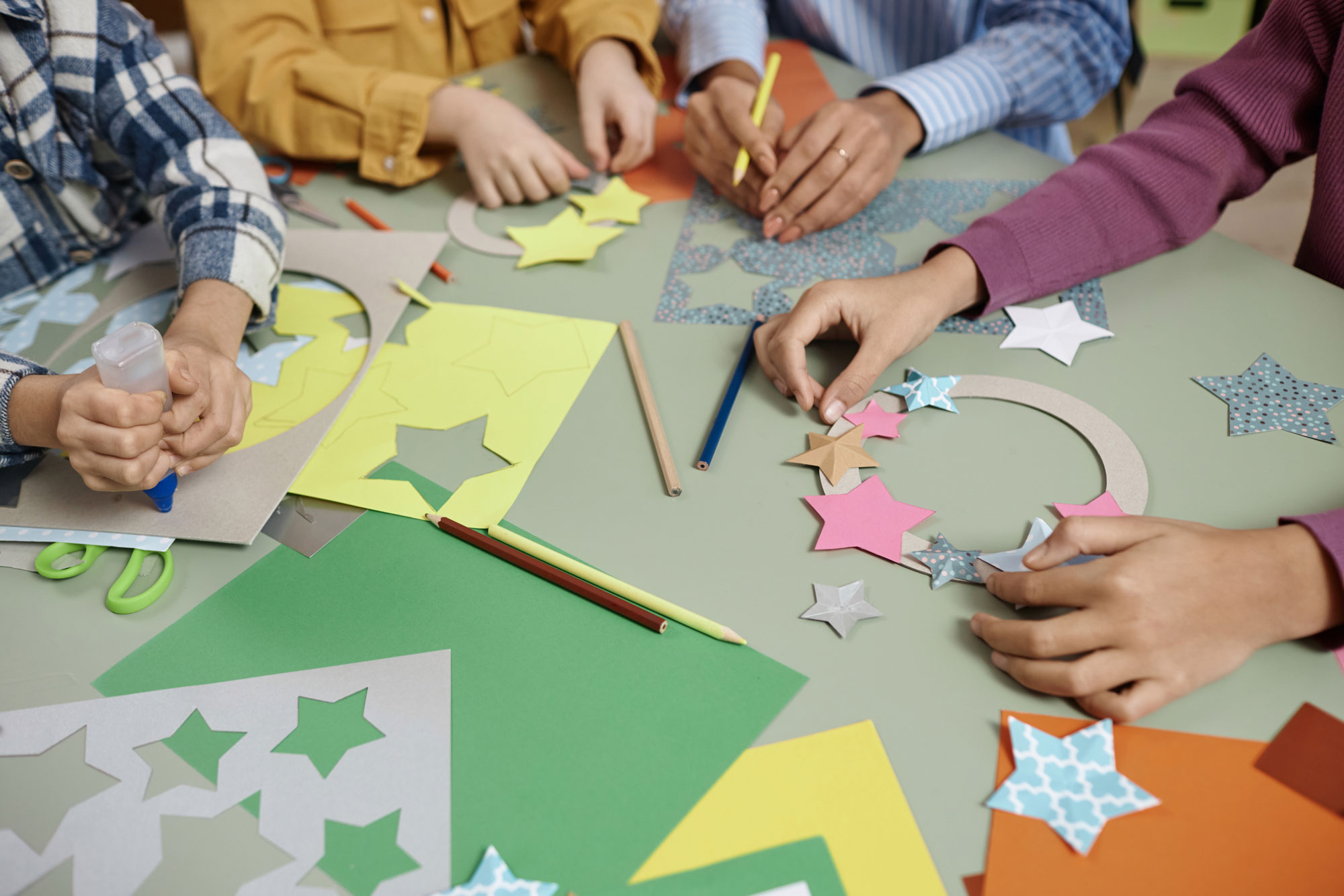 Hands making paper crafts